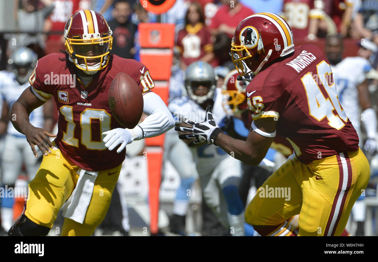 Detroit Lions wide receiver Calvin Johnson (L) and teammate safety Louis  Delmas in jubilation as they leave the field after a 27-20 win against the  Washington Redskins at FedEx Field, Landover Maryland