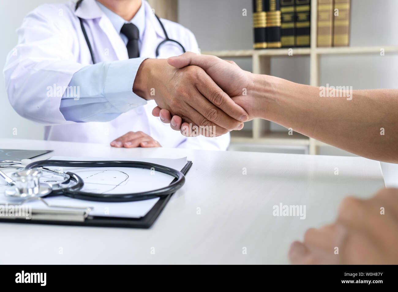 Professor Doctor having shaking hands with patient after