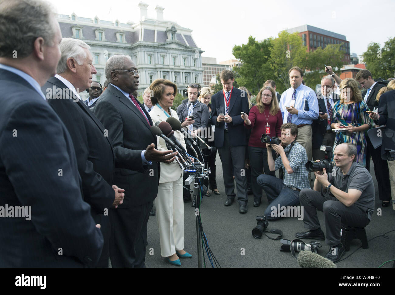 Rep. Jame Clyburn (R-SC) speaks to the media following a meeting with President Barack Obama on the debt limit and reopening the government at the White House in Washington, D.C. on October 15, 2013. Clyburn was joined by, from left to right, Rep. Chris Van Hollen (D-MD) House Minority Whip Steny Hoyer (D-MD) and House Minority Leader Nancy Pelosi (D-CA). UPI/Kevin Dietsch Stock Photo