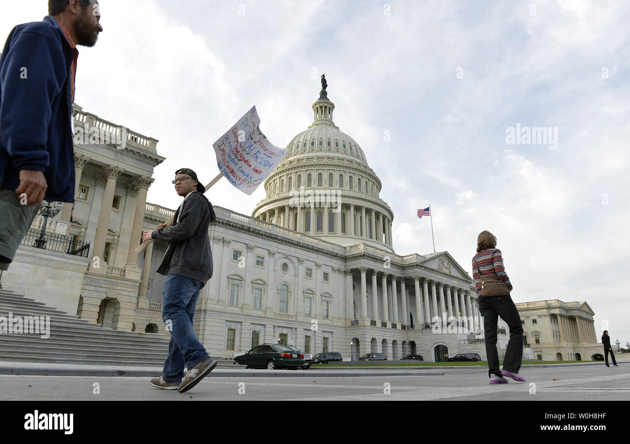 Esau Bangura Of Washington Dc Carries A Sign To Protest The
