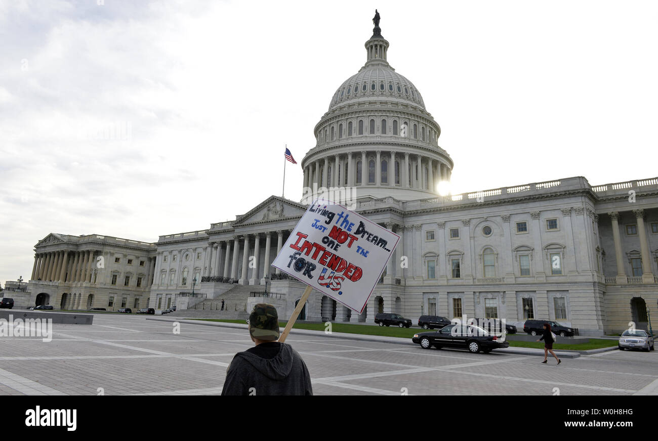 Esau Bangura Of Washington Dc Carries A Sign To Protest The