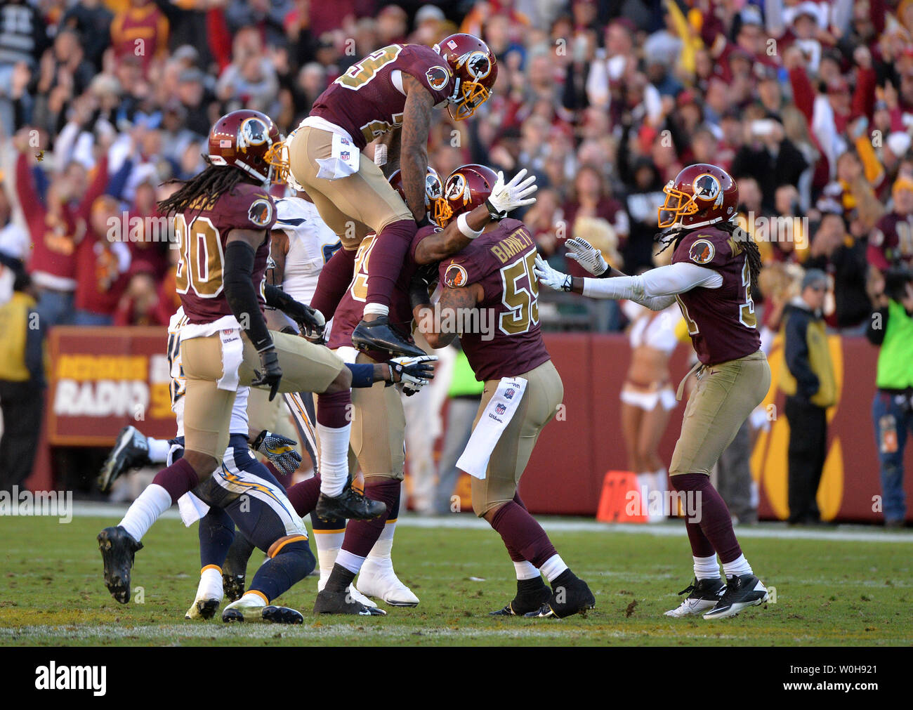 Washington Redskins free safety David Amerson (39) celebrates with teammate after intercepting a ball in the fourth quarter against the San Diego Chargers, at FedEx Field in Landover, Maryland on November 3, 2013. The Redskins defeated the Chargers 30-24. UPI/Kevin Dietsch Stock Photo