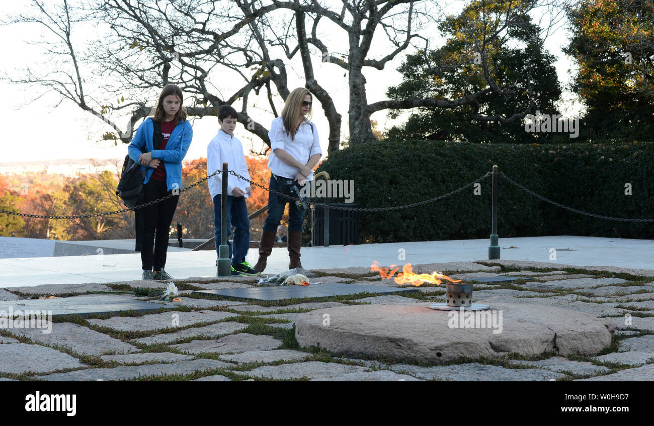 People visit the eternal flame and grave of President John Fitzgerald Kennedy  at Arlington National Cemetery in Arlington, Virginia on November 18, 2013.  Kennedy was the 35th president of the United States and November 22nd will mark the 50th Anniversary of his assassination in Dallas, Texas.    UPI/Pat Benic Stock Photo