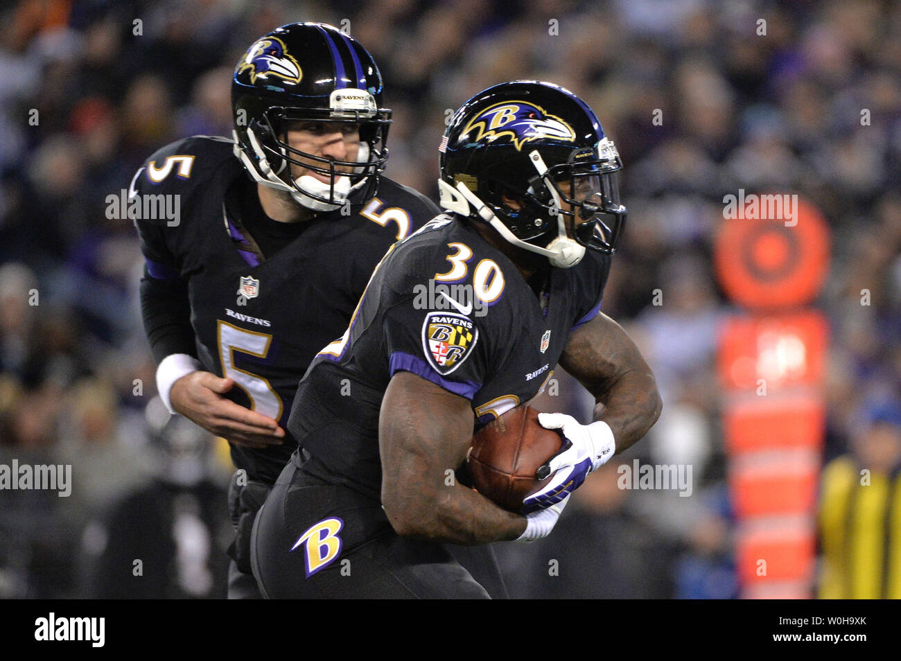 Baltimore Ravens quarterback Joe Flacco talks on a sideline phone during  the NFL football game between the Pittsburgh Steelers and the Baltimore  Ravens in Pittsburgh, Sunday, Dec. 27, 2009. (AP Photo/Keith Srakocic