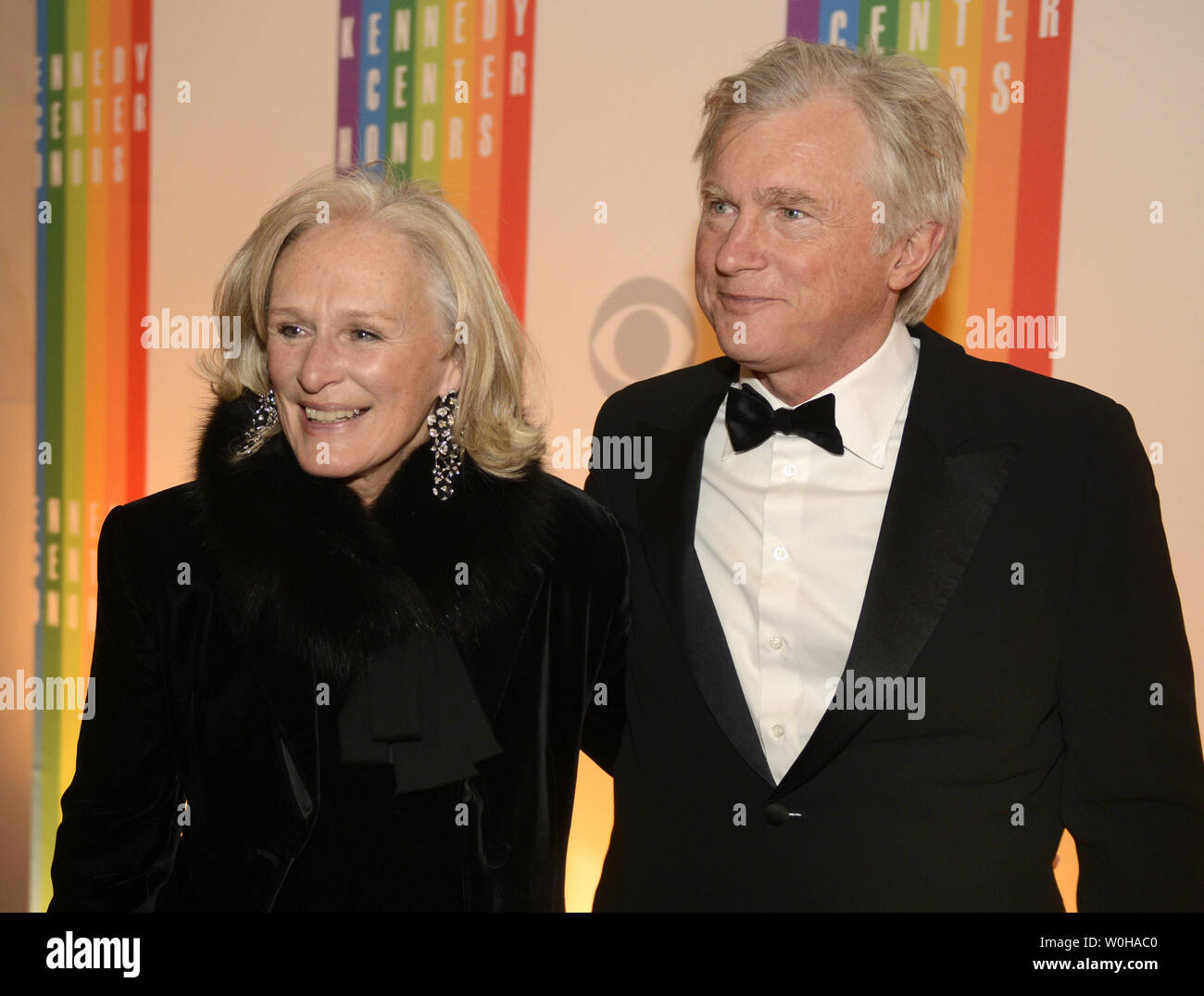 Actress Glenn Close and her escort David Shaw pose for photographers on the red carpet as they arrive for an evening of gala entertainment at the 2013 Kennedy Center Honors, December 8, 2013 in Washington, DC. The Honors are bestowed annually on five artists for their lifetime achievement in the arts and culture.    UPI/Mike Theiler Stock Photo