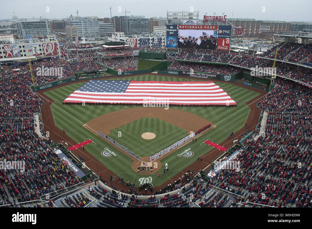 Washington Nationals' fans wear rain gear on the Nationals' opening day  game against the Atlanta Braves at Nationals Park in Washington, March 31,  2011. UPI/Kevin Dietsch Stock Photo - Alamy