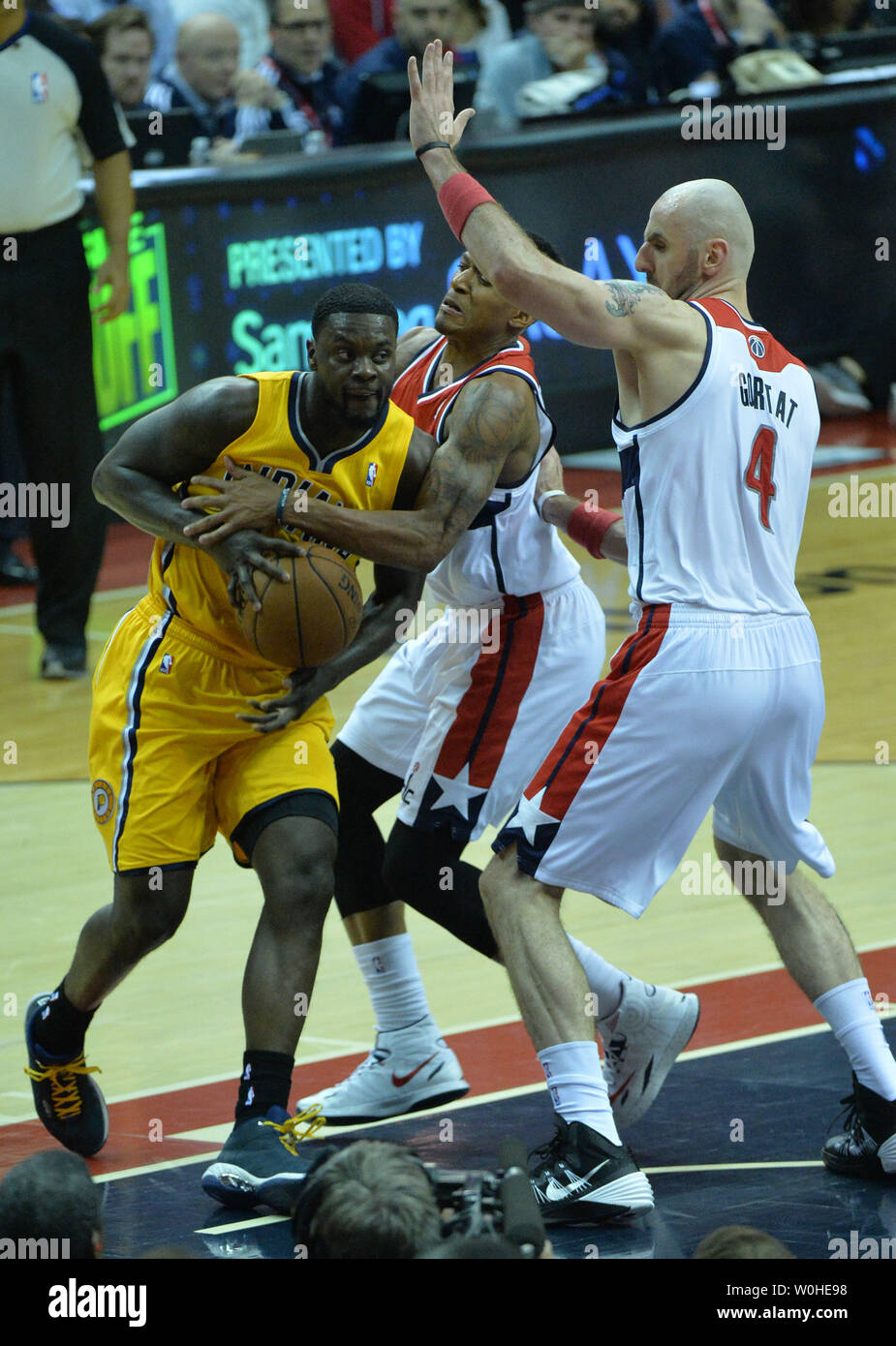 Indiana Pacers guard Lance Stephenson (1) drives to the basket against Washington Wizards guard Bradley Beal (3) and Marcin Gortat during the 1st half of game six of the Eastern Conference Semifinals at the Verizon Center in Washington, D.C. on May 15, 2014. UPI/Kevin Dietsch Stock Photo