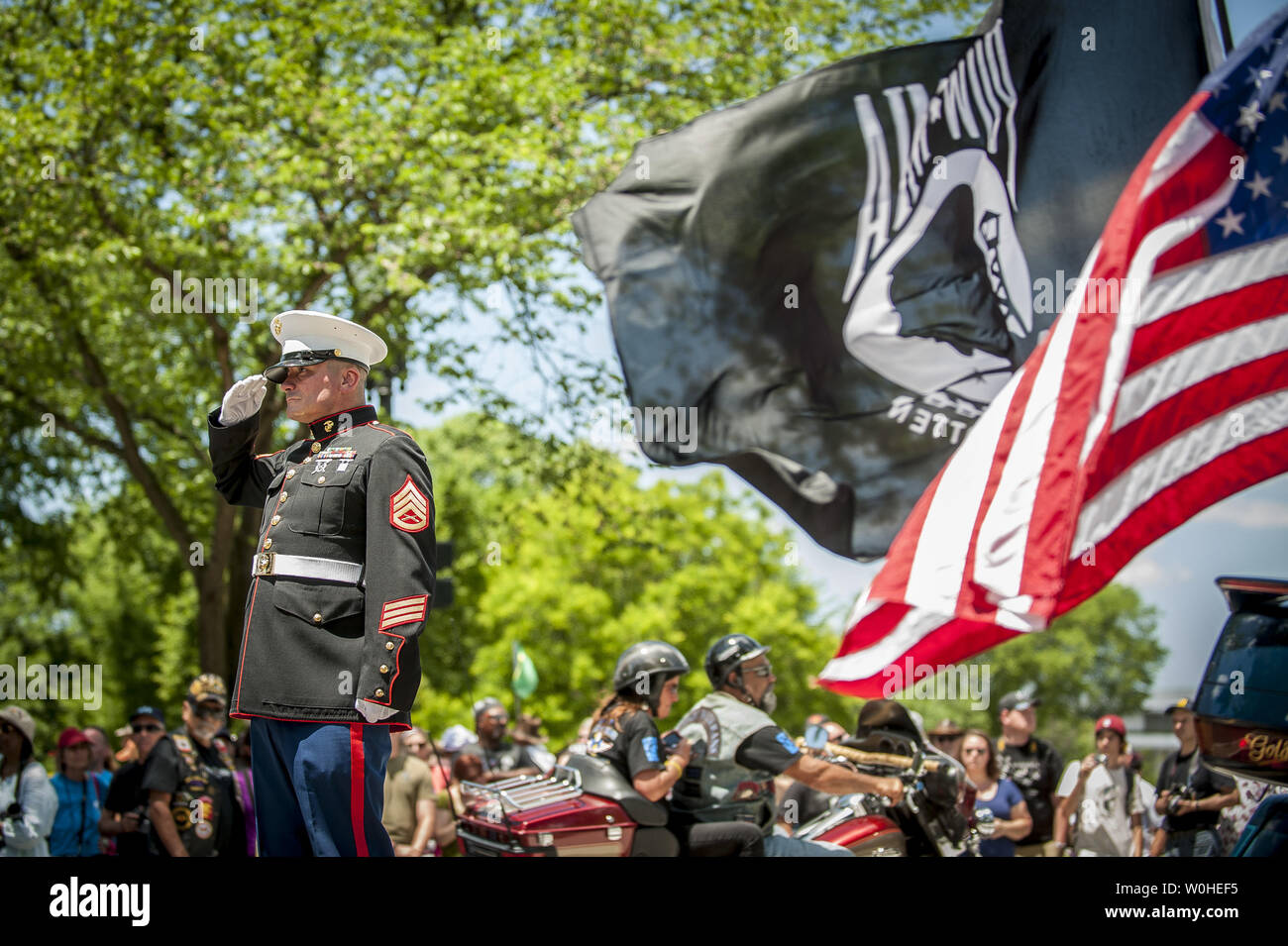 For the 12th consecutive year, former United States Marine Tim Chambers holds a salute to honor fallen veterans as hundreds of thousands of motorcycle riders participate in the Rolling Thunder Motorcycle Rally XXVII, on Memorial Day weekend, May 25, 2014 in Washington, D.C. Hundreds of thousands of bikers annually converge on Washington for the rally to remember America's military veterans, POWs and MIAs.   UPI/Pete Marovich Stock Photo