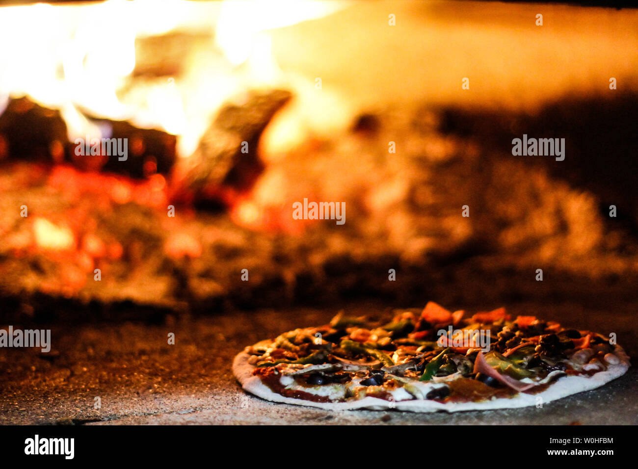 Pizza baked in wood. Pizza. Italian food.. Piza horneada a la leña. Pizza. Comida italiana. Stock Photo