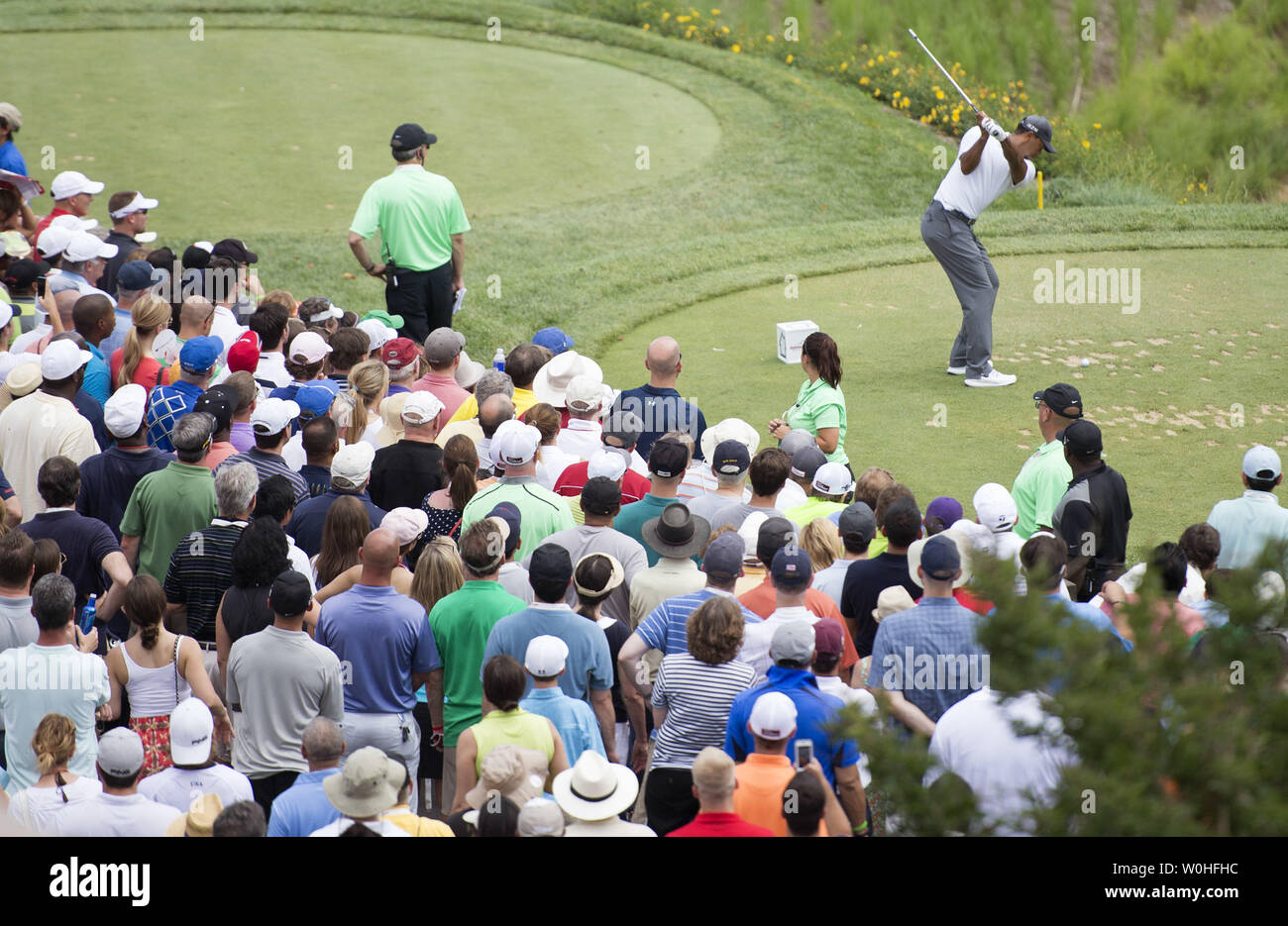 Tiger Woods hits off of the 10th tee during the second round of the Quicken Loans Nationals at Congressional Country Club, in Potomac, Maryland on June 27, 2014.  UPI/Kevin Dietsch Stock Photo