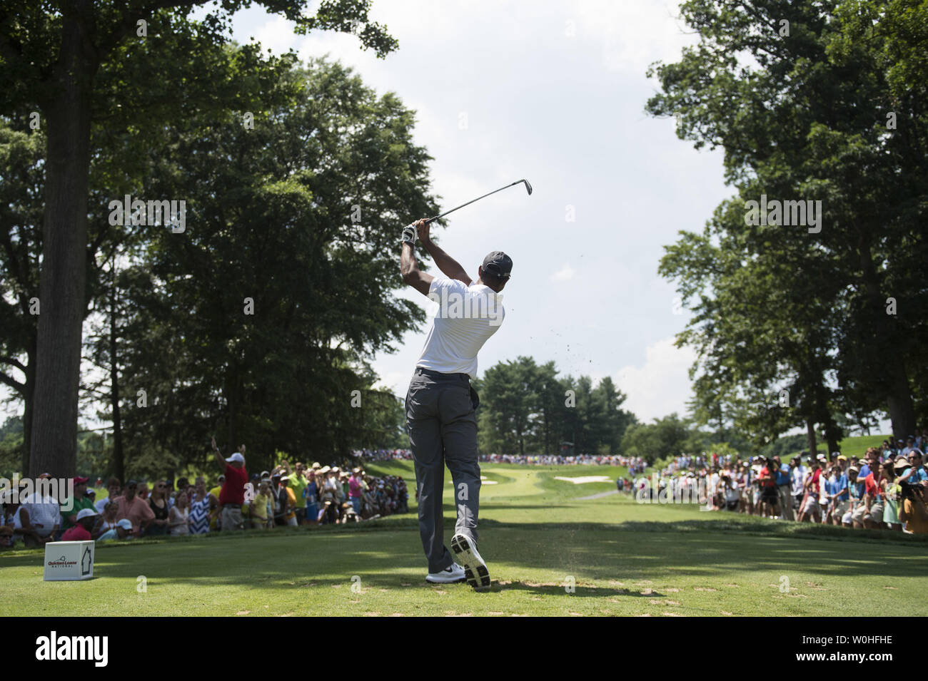 Tiger Woods hits off of the 7th tee during the second round of the Quicken Loans Nationals at Congressional Country Club, in Potomac, Maryland on June 27, 2014.  UPI/Kevin Dietsch Stock Photo