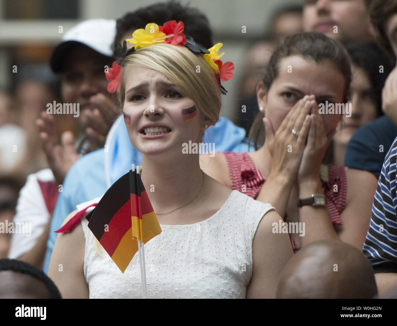 Fans watch the 2014 World Cup final between Germany and Argentina during a watch party held at the Smithsonian Portrait Gallery, in Washington, D.C. on July 13, 2014. Germany defeated Argentina 1-0. UPI/Kevin Dietsch Stock Photo