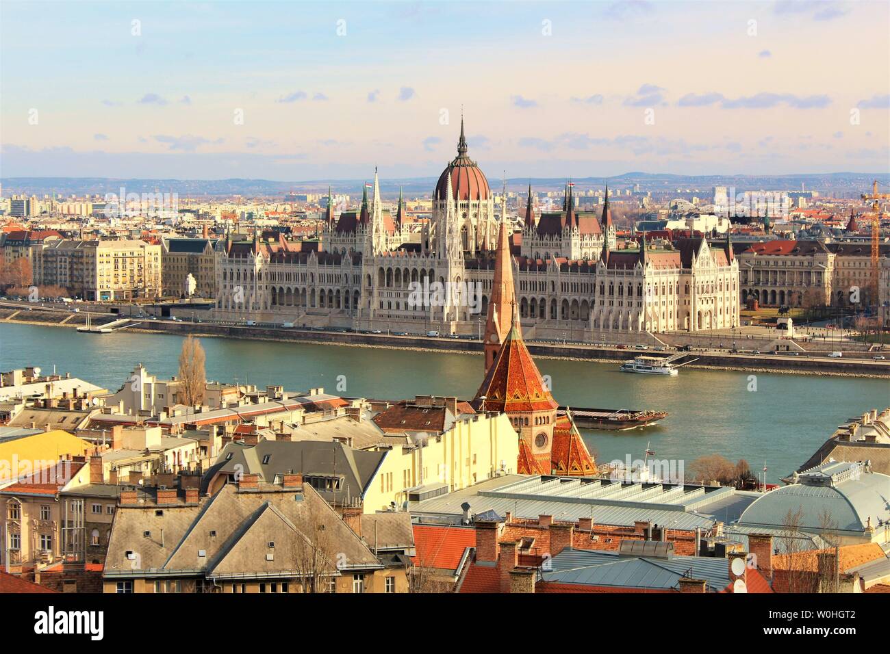 View across the Buda side of Budapest and the river Danube, of the Hungarian House of Parliament which sits on the Pest side of the Danube banks. Stock Photo