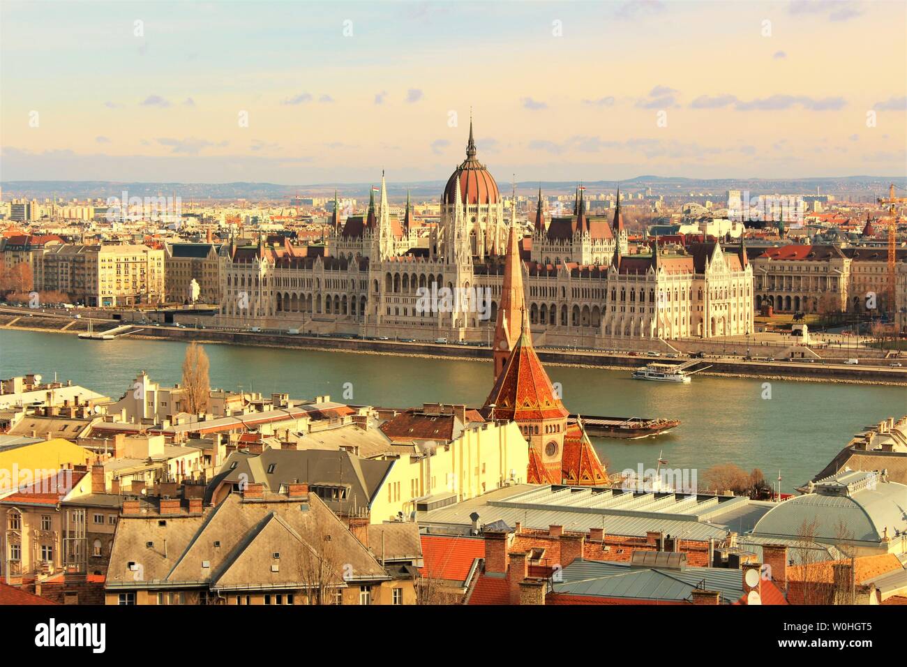 View across the Buda side of Budapest and the river Danube, of the Hungarian House of Parliament which sits on the Pest side of the Danube banks. Stock Photo