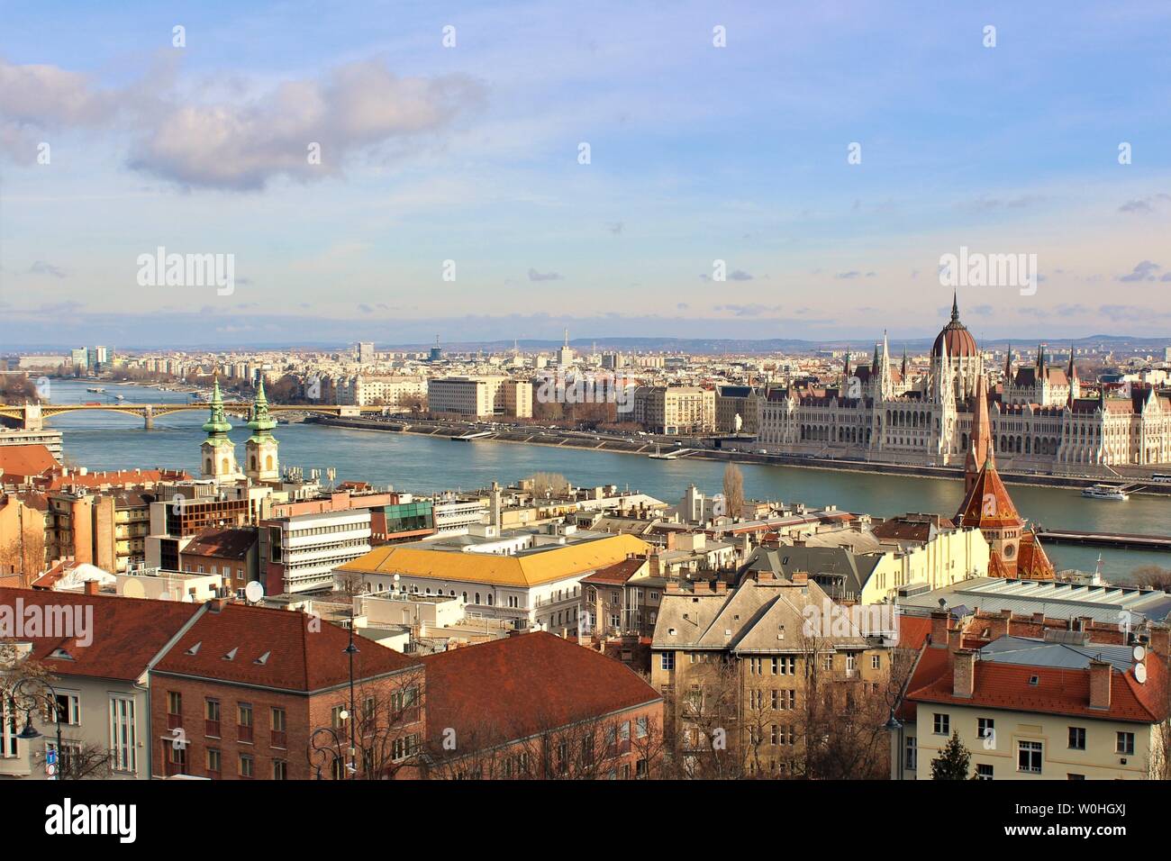 View of the Hungarian capital city of Budapest, including the iconic Danube River, House of Parliament and Margaret Bridge. Stock Photo