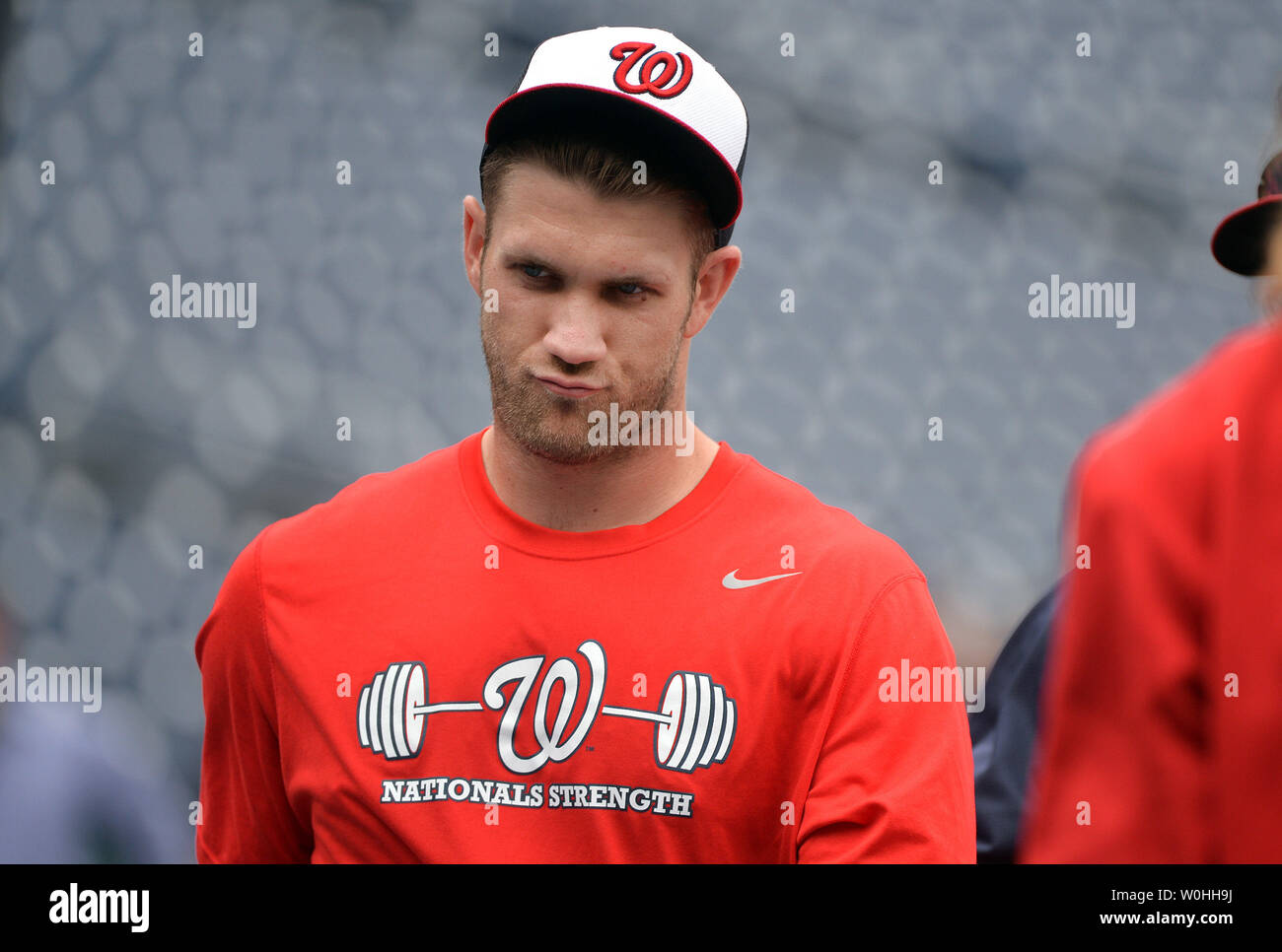 Washington Nationals left fielder Bryce Harper walks off the field after taking batting practice
