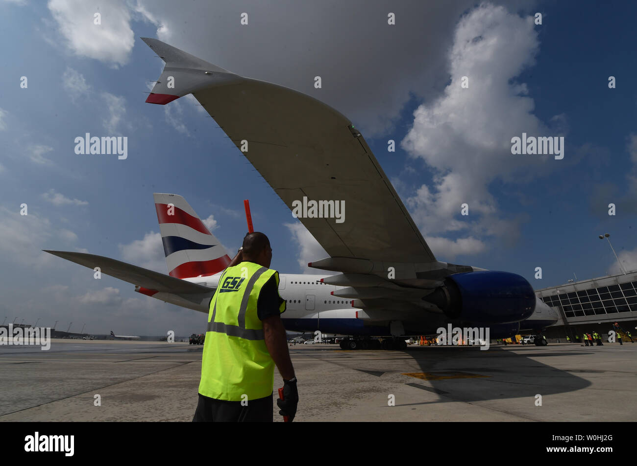 British Airways' new Airbus A380 parks at the gate after its inaugural
