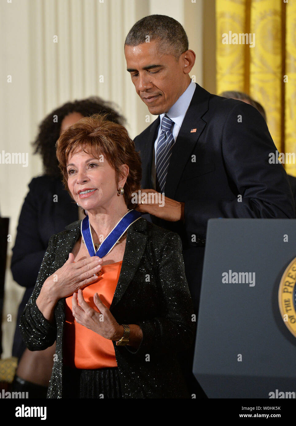 President Barack Obama awards author Isabel Allende a Presidential Medal of Freedom during a ceremony at the White House in Washington, D.C. on November 24, 2014. UPI/Kevin Dietsch Stock Photo