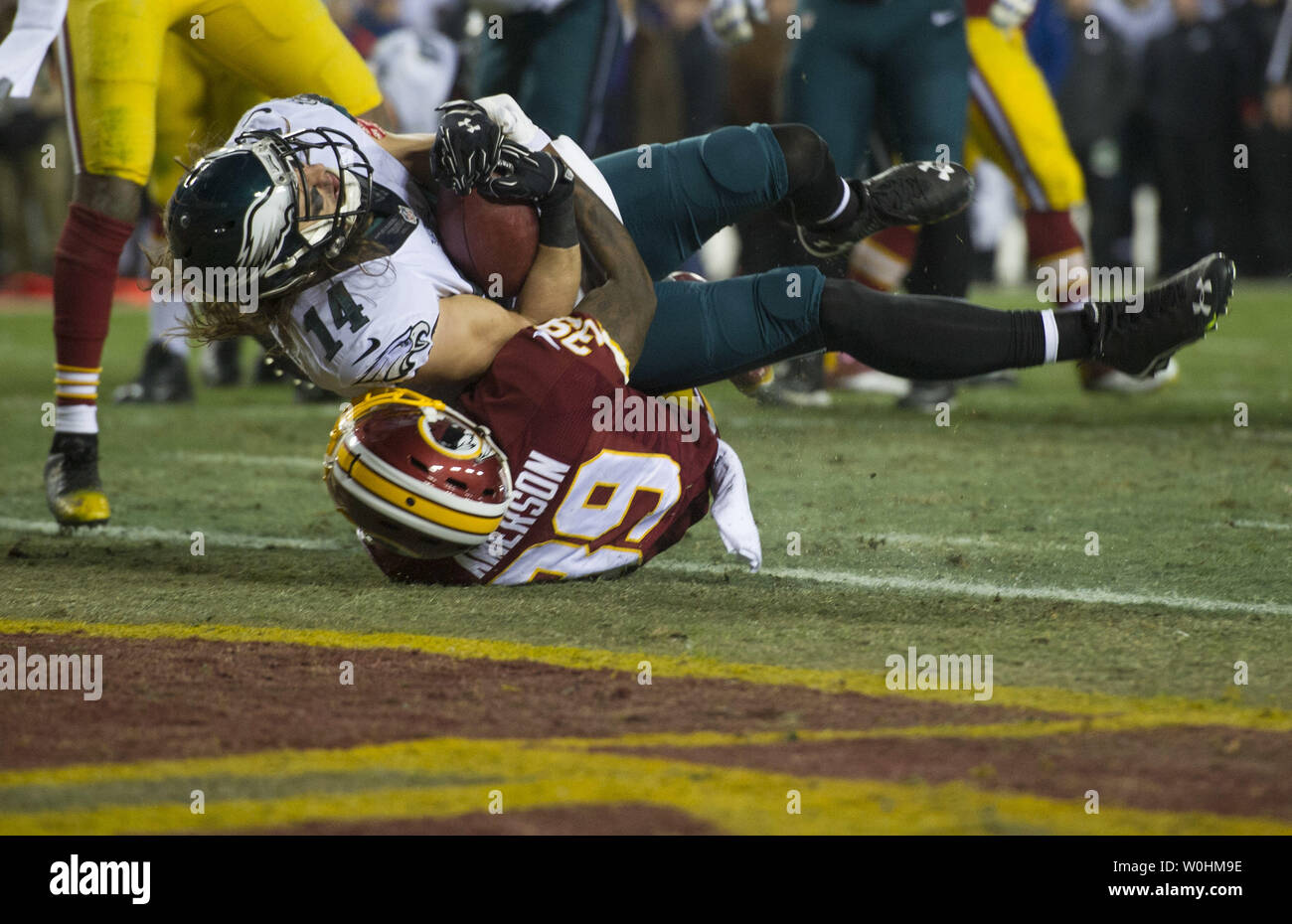 Philadelphia Eagles wide receiver Riley Cooper brings in a 3-yard touchdown against Washington Redskins cornerback David Amerson in the second quarter at FedEx field in Landover, Maryland on December 20, 2014.  UPI/Kevin Dietsch Stock Photo