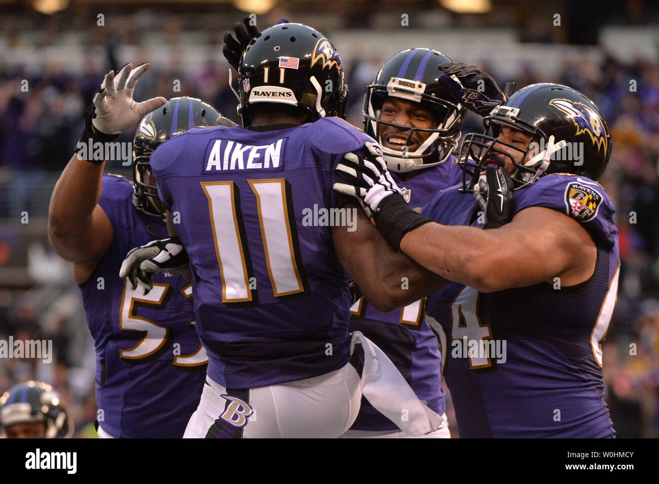 Baltimore Ravens wide receiver Kamar Aiken (11) celebrates with teammates  after scoring a 2-yard touchdown against the Cleveland Browns at M&T Bank  Stadium in Baltimore, Maryland on December 28, 2014. The Ravens