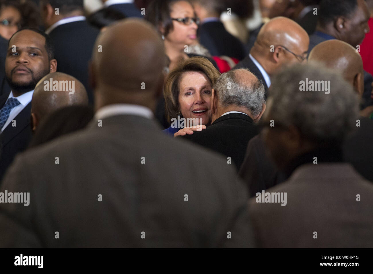 House Minority Leader Nancy Pelosi, D-Calif, greets guest during an African American History Month reception hosted by President Obama in the East Room at the White House in Washington, D.C. on February 26, 2015.  Photo by Kevin Dietsch/UPI Stock Photo