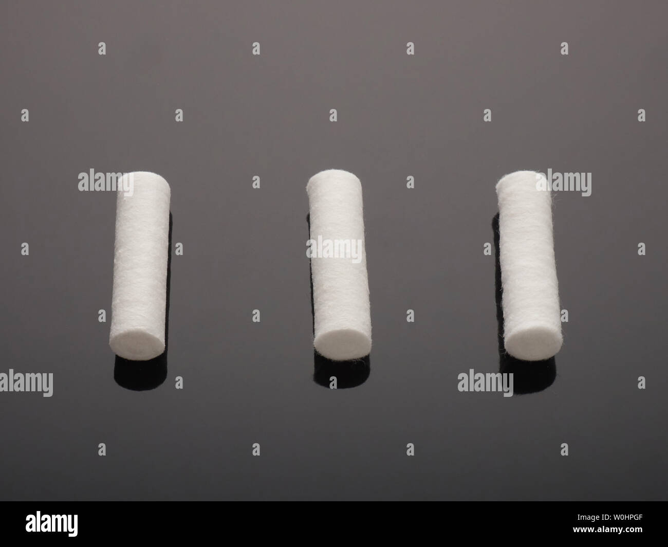 Dental cotton swabs on gray background with a gradient Stock Photo Alamy