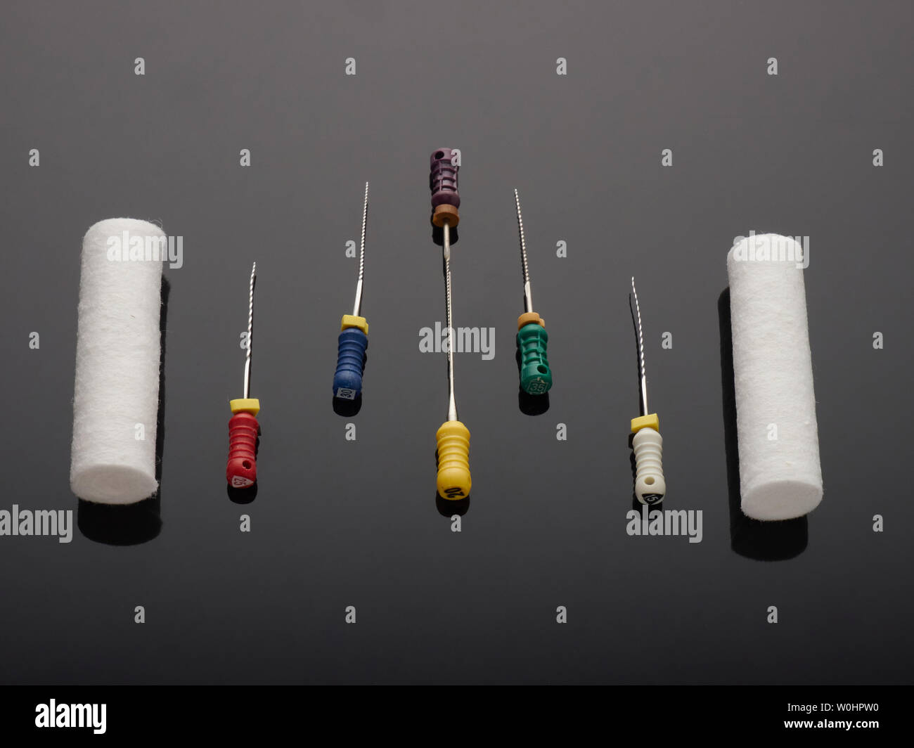 Dental cotton swabs and tools for the removal of dental nerves on a