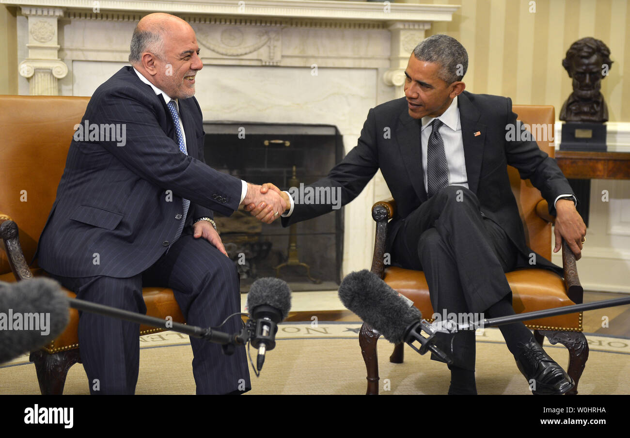 U.S. President Barack Obama (R) shakes hands with Iraqi Prime Minister ...