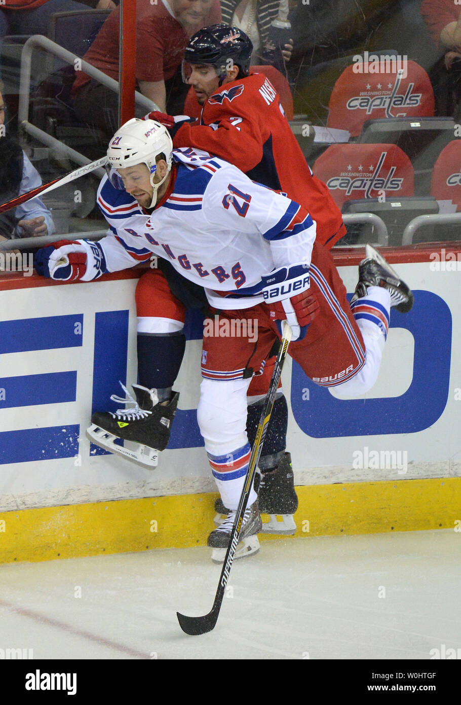 New York Rangers center Derek Stepan (21) hits Washington Capitals defenseman Matt Niskanen (2) in the first period of the fourth game of round 2 of the Stanley Cup Playoffs at the Verizon Center in Washington, D.C. on May 6, 2015. Photo by Kevin Dietsch/UPI Stock Photo
