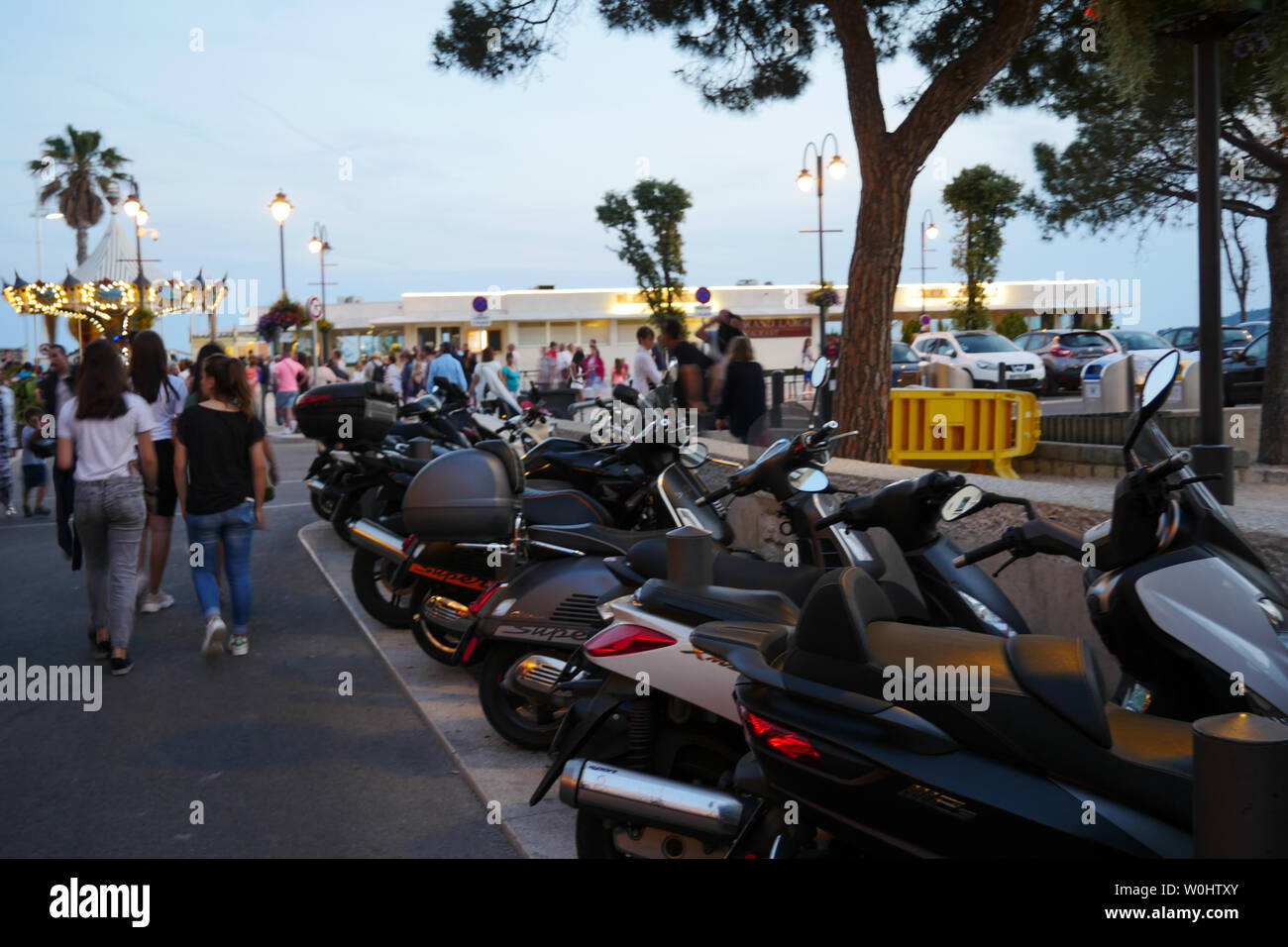 People wander in the street at twilight, Cassis, Bouches-du-Rhone, France Stock Photo