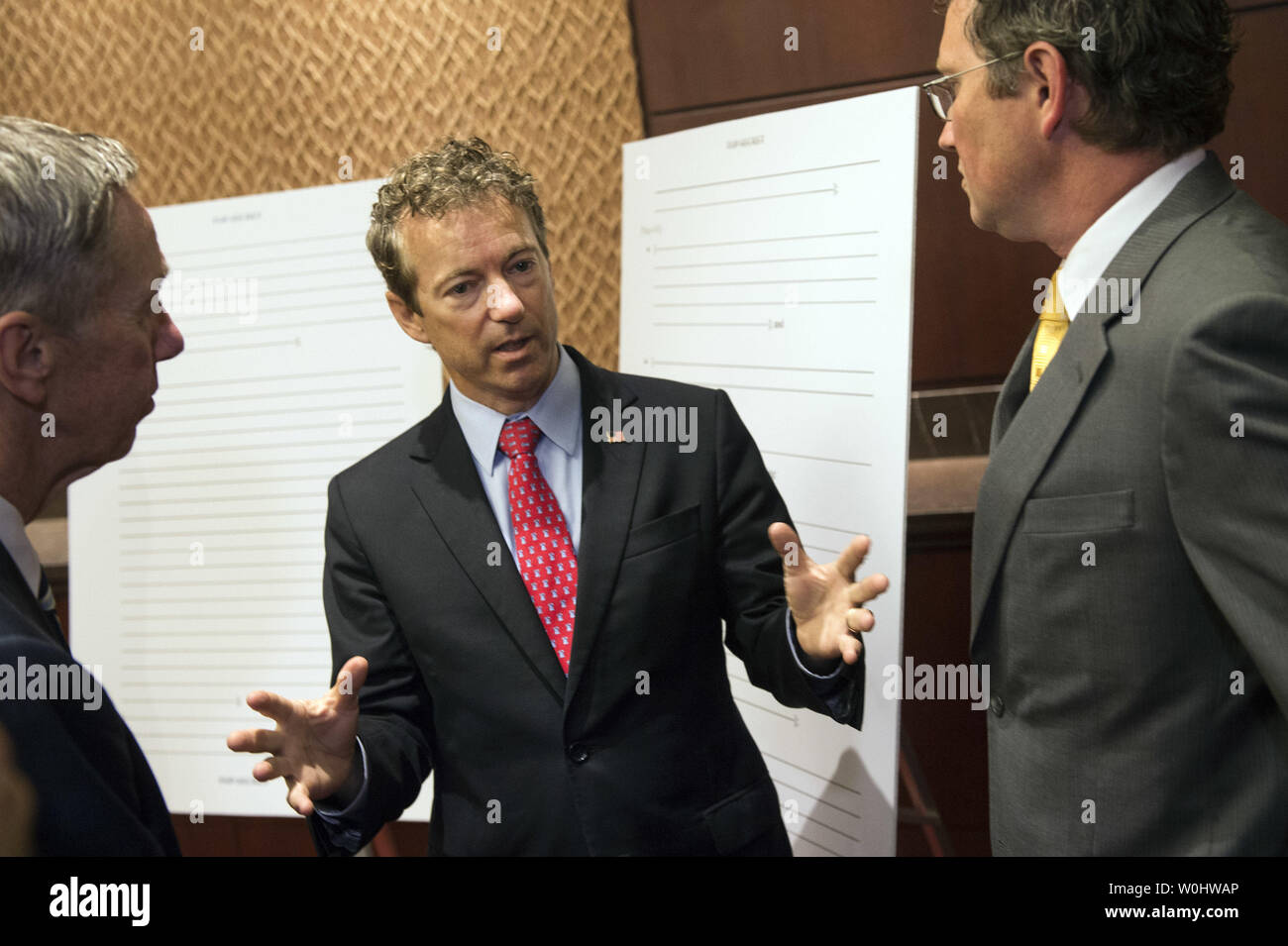 Sen. Rand Paul, R-KY, (L) talks to Rep. Stephen Lynch, (D-MA) and Rep. Thomas Massie (R-KY) as they arrive to a news conference on the 'Transparency for the Families of 9/11 Victims and Survivors Act of 2015' on Capitol Hill in Washington, D.C., on June 2, 2015. The law requires President Obama to declassify and make available to the public the redacted 28 pages from the Joint Inquiry into Intelligence Community Activities Before and After the Terrorist Attacks of September 2001. Photo by Kevin Dietsch/UPI Stock Photo