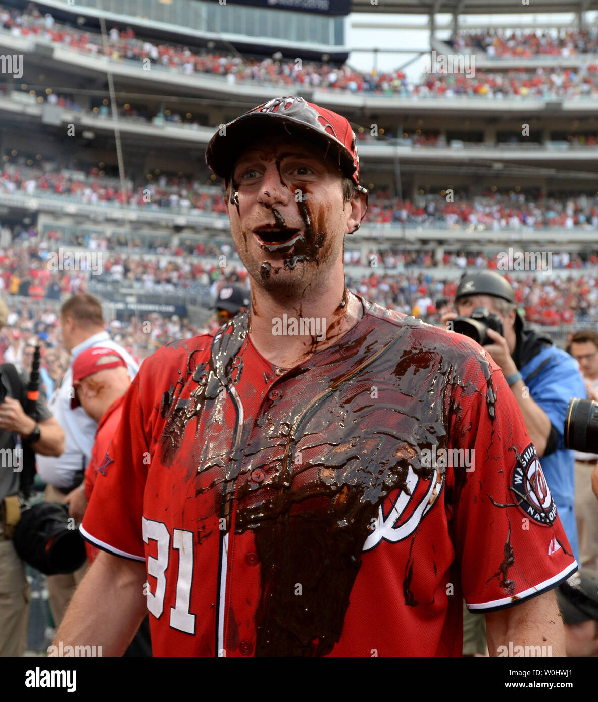 Washington Nationals Max Scherzer can only smile as he is drenched in  celebratory chocolate syrup after pitching a no-hitter against the  Pittsburgh Pirates at Nationals Park on June 20, 2015 in Washington