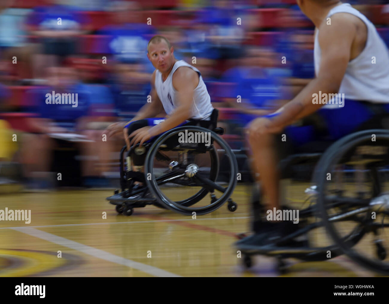 Team Air Force's Benjamin Seekell watches for the ball while racing to the opposite end of the court during their game against Team Army in the Wheelchair Basketball bronze medal game of the 2015 Department Of Defense Warrior Games at the United States Marine Corps base in Quantico, Va.,  June 22, 2015.  Photo by Molly Riley/UPI Stock Photo