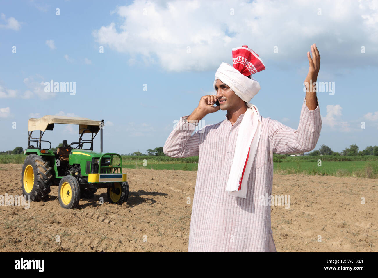 Indian farmer talking on a mobile phone Stock Photo