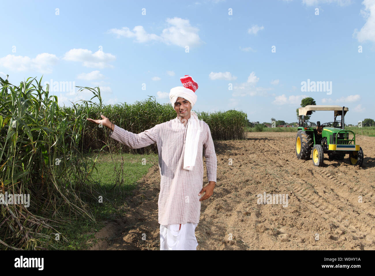 Portrait of an Indian farmer showing his field Stock Photo - Alamy