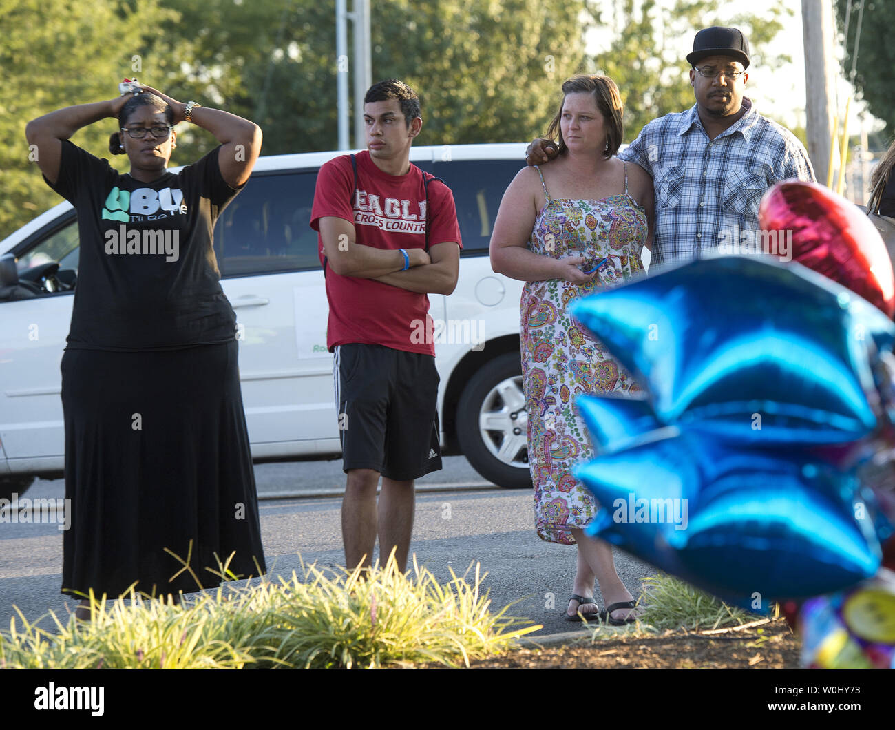 Mourners gather at a memorial at the WDBJTV station after reporter