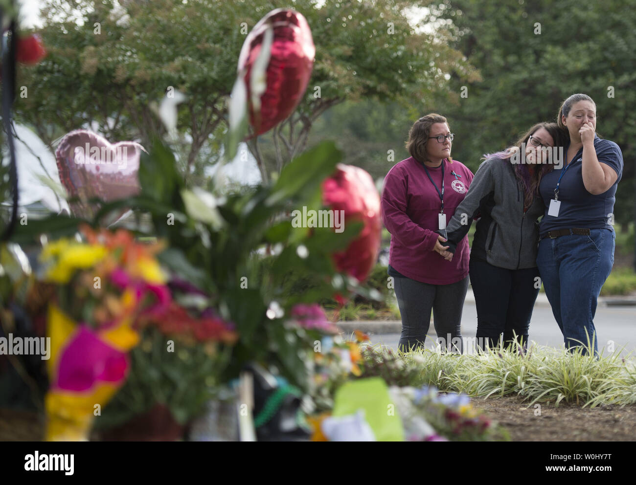 WDBJ7 TV station staff mourn at a memorial for slain reporter Alison