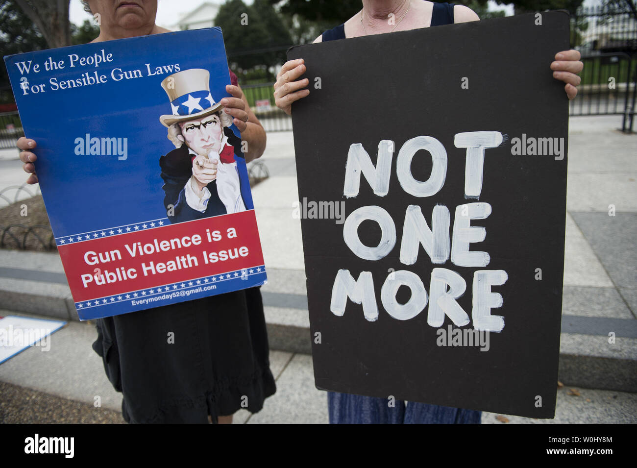 Members of the gun law advocacy group We The People For Sensible Gun Laws hold a rally calling on Congress to strengthen gun laws to require gun safety training, reinstate the assault weapons ban and ban high capacity .ammunition magazines, near the White House in Washington, D.C. on August 31, 2015. Photo by Kevin Dietsch/UPI Stock Photo
