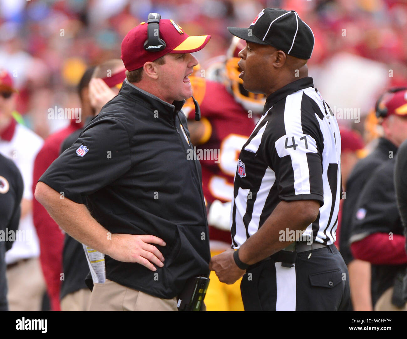 NFL referee Jerome Boger (23) watches a replay during the second half of an  NFL football game between the Minnesota Vikings and the Washington  Commanders, Sunday, Nov. 6, 2022, in Landover, Md. (