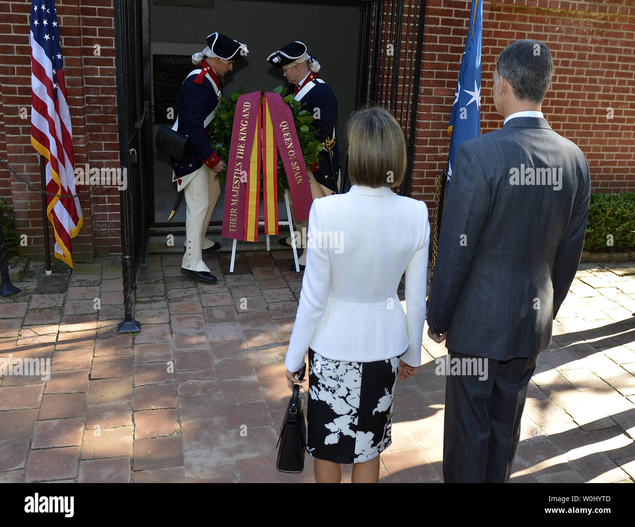 Spain's King Felipe VI (R) and Queen Letizia stand at attention as soldiers in colonial uniforms place a wreath at the tomb of America's first President George Washington, September 15, 2015, at Mount Vernon, Virginia. The Royals visit was to emphasize the long standing historic relations between Spain and the United States.     Photo by Mike Theiler/UPI Stock Photo