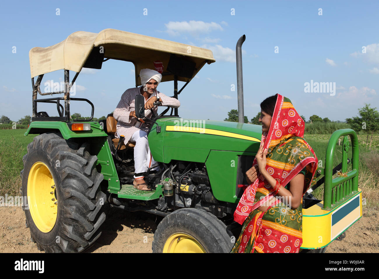 Farmer with his wife in a field Stock Photo - Alamy