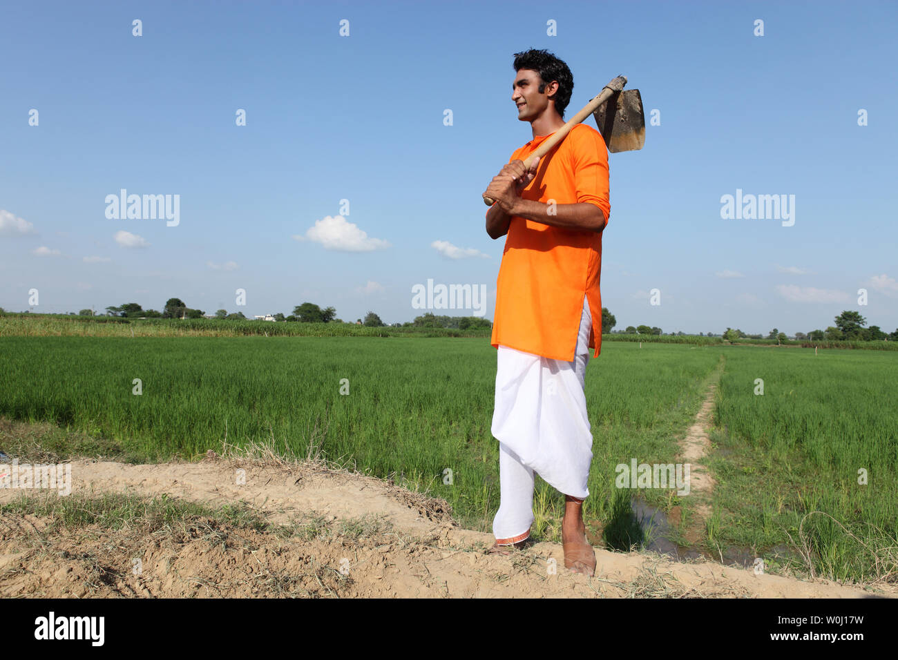 Indian farmer standing working in hi-res stock photography and images ...