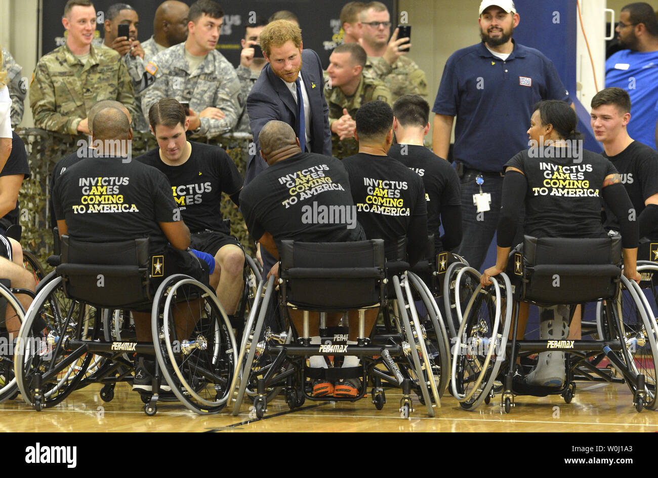 HRH Prince Harry thanks members of the basketball team at the conclusion of  a game by wounded service members, October 28, 2015, at Ft. Belvoir, Virginia. The event is a celebration of the Joining Forces Initiative and the upcoming 2016 Invictus Games in Orlando, Florida, in which wounded military personnel compete in sporting competition.       Photo by Mike Theiler/UPI Stock Photo