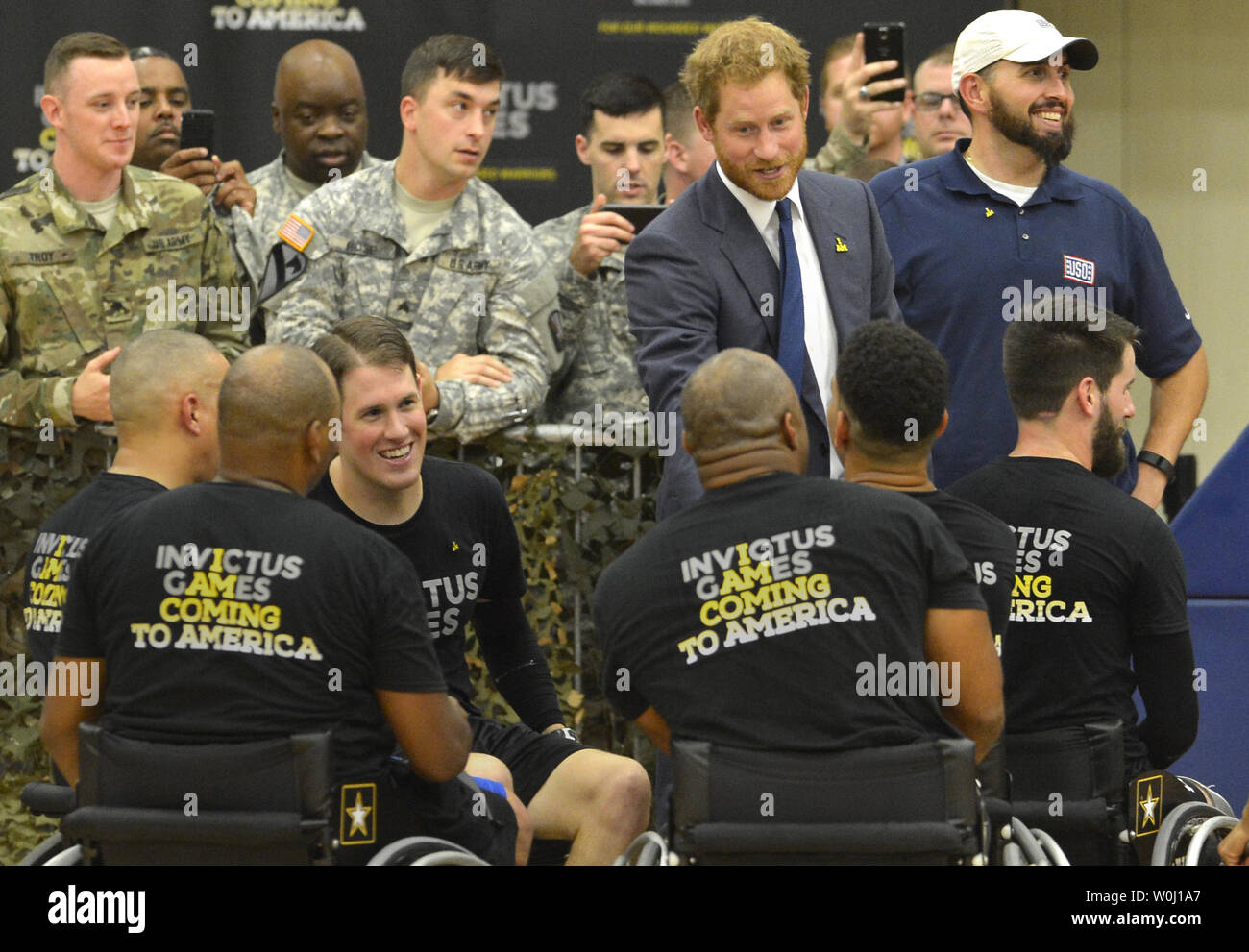 HRH Prince Harry thanks members of the basketball team at the conclusion of  a game by wounded service members, October 28, 2015, at Ft. Belvoir, Virginia. The event is a celebration of the Joining Forces Initiative and the upcoming 2016 Invictus Games in Orlando, Florida, in which wounded military personnel compete in sporting competition.       Photo by Mike Theiler/UPI Stock Photo