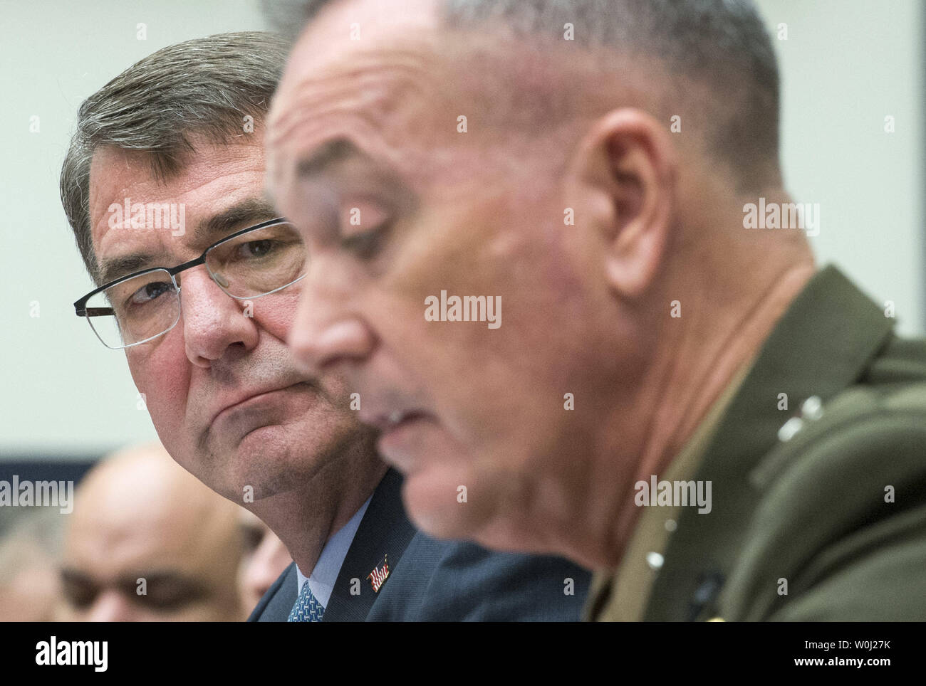 Secretary of Defense Ashton Carter (L) and  Chairman of the Joint Chiefs of Staff General Joseph F. Dunford, Jr., USMC, testify during a House Armed Services Committee hearing on the U.S. Strategy for Syria and Iraq and its implications for the region, on Capitol Hill in Washington, D.C. on December 1, 2015. Photo by Kevin Dietsch/UPI. Stock Photo