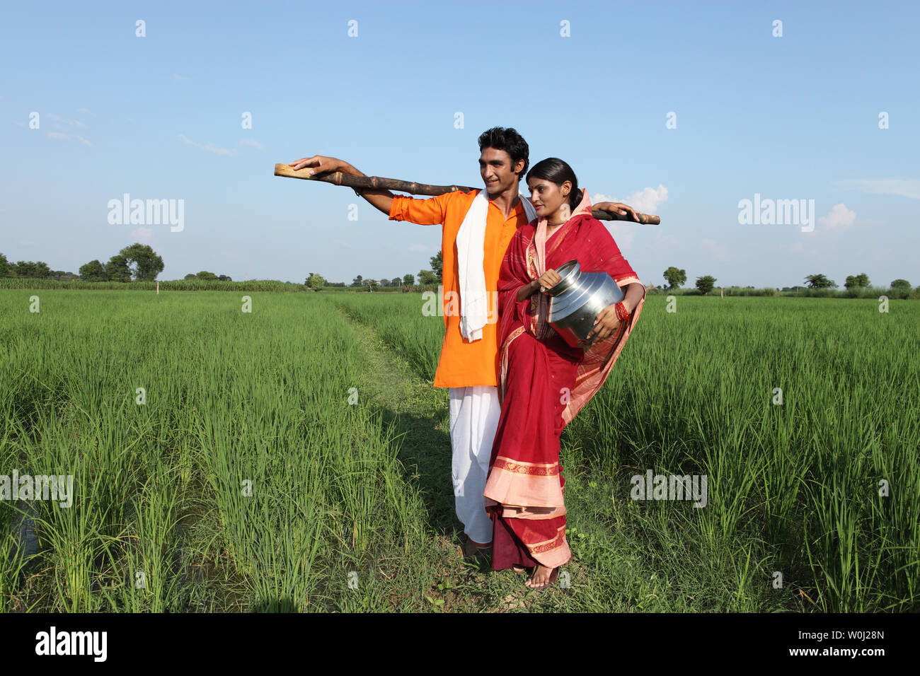 Farmer with his wife standing in a field Stock Photo - Alamy