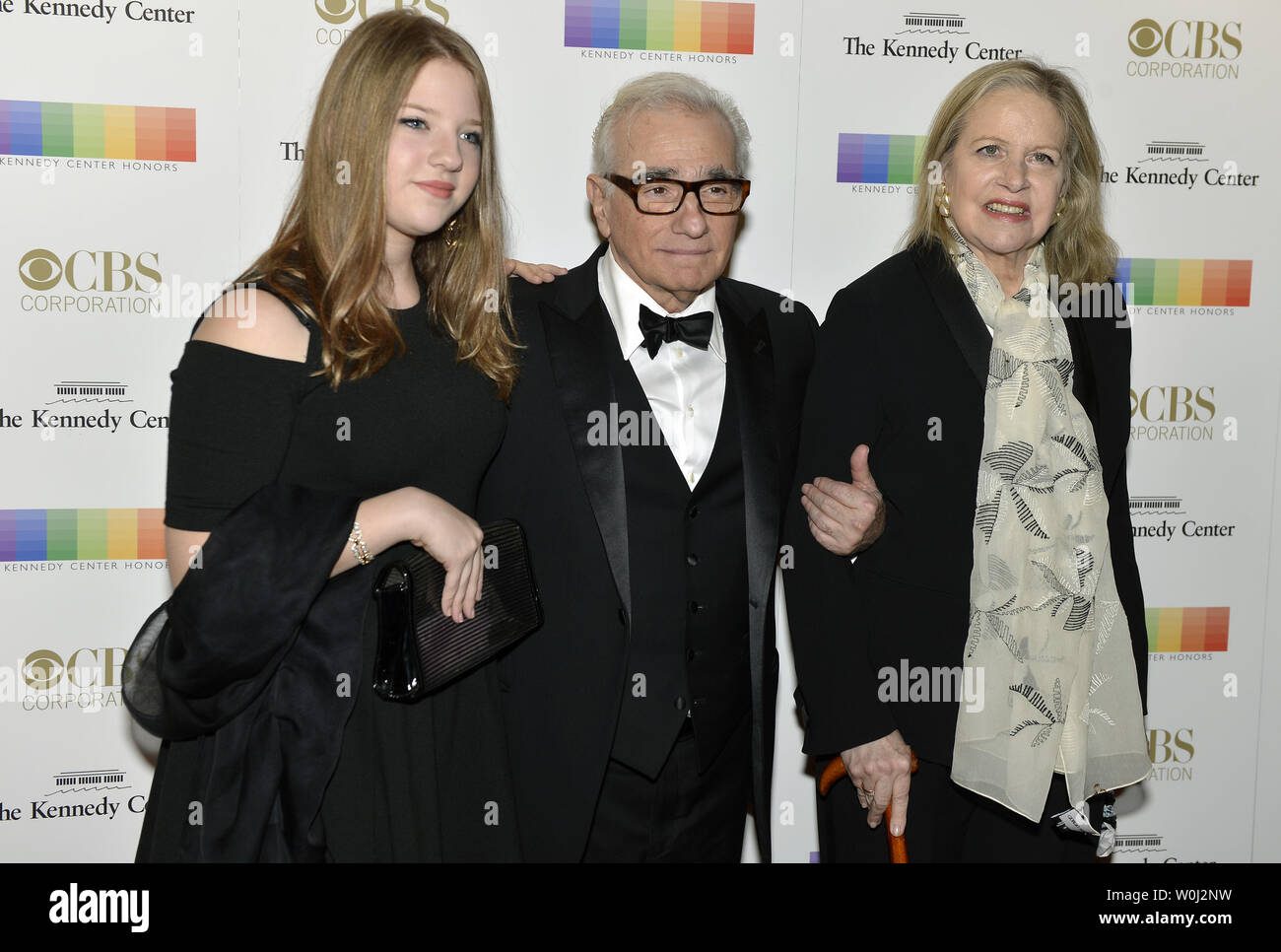 Film Director Martin Scorsese (C), his wife Helen Morris (R) and daughter Francesca pose for photographers on the red carpet as they arrive for an evening of gala entertainment at the Kennedy Center, December 6, 2015, in Washington, DC.  The Honors are bestowed annually on five artists for their lifetime achievement in the arts and culture.    UPI/Mike Theiler Stock Photo