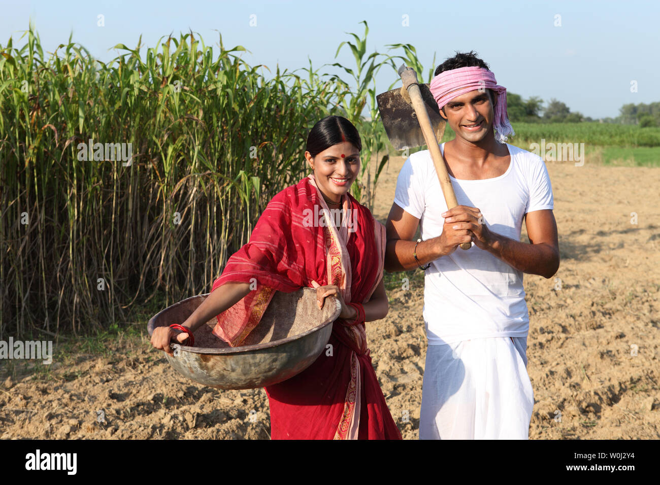 Farmer with his wife working in a field Stock Photo - Alamy
