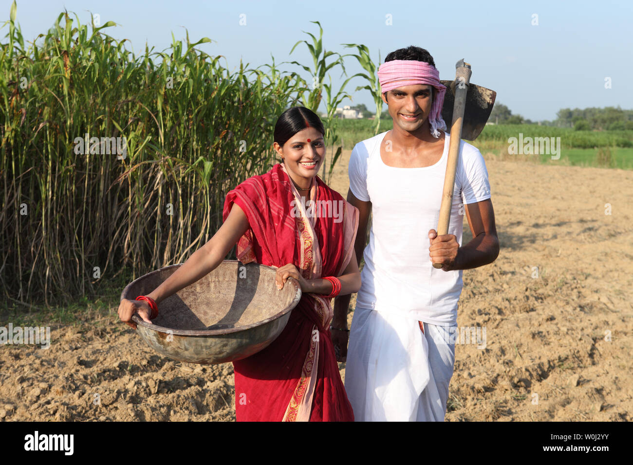 Farmer with his wife working in a field Stock Photo - Alamy