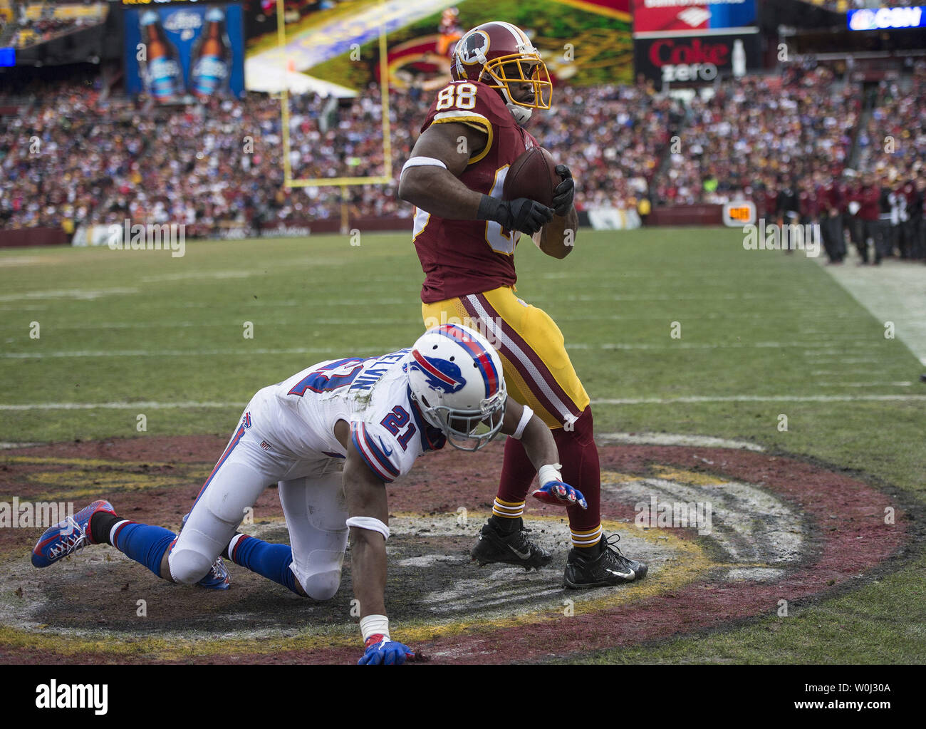 Washington Redskins wide receiver Pierre Garcon scores a touchdown over Buffalo Bills strong safety Leodis McKelvin (21) in the fourth quarter at FedEx Field in Landover, Maryland on December 20, 2015. Photo by Kevin Dietsch/UPI Stock Photo